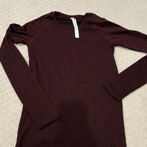 Lululemon Athletica Burgundy Long Sleeve Top with logo all over nwot